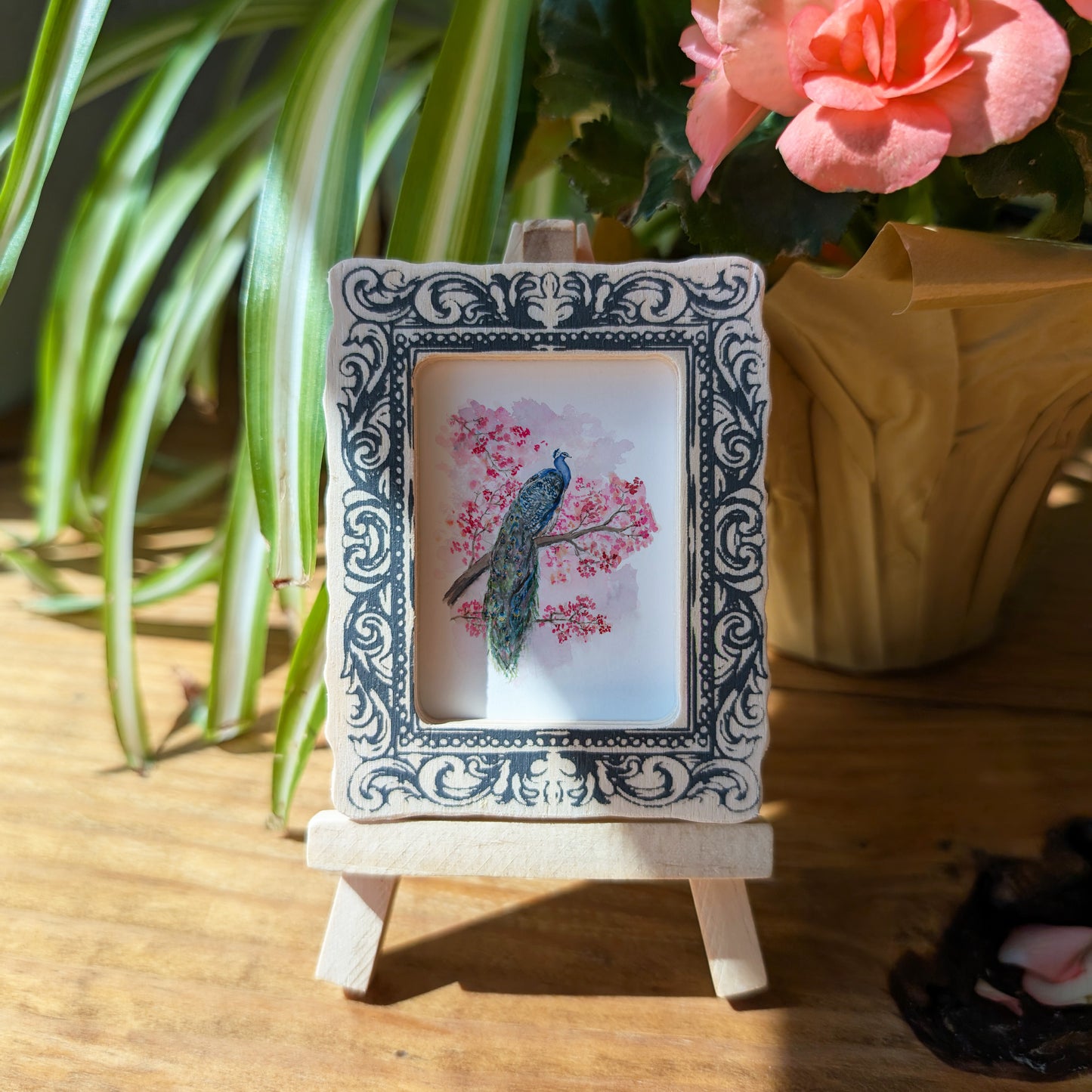 a small picture frame with a bird on it