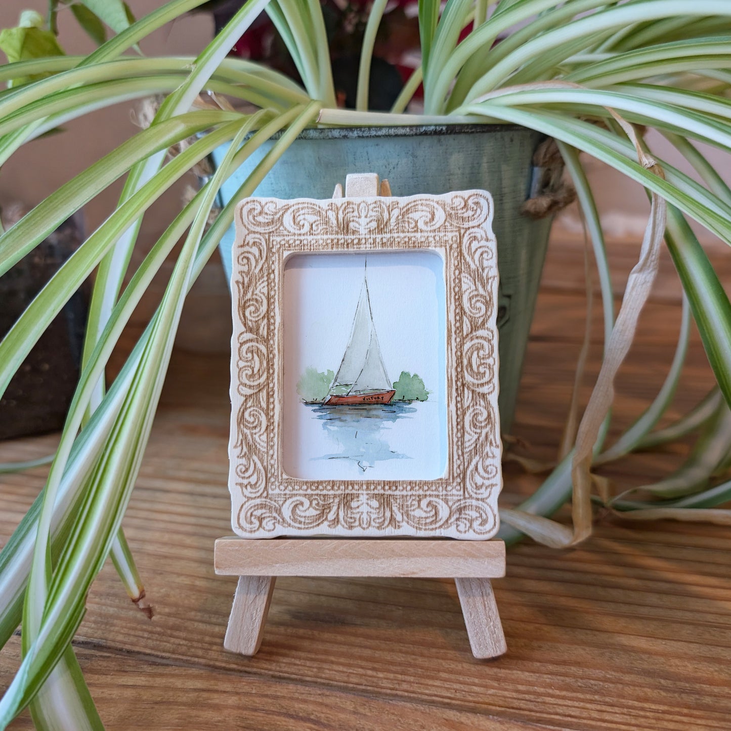 a picture frame with a picture of a sailboat