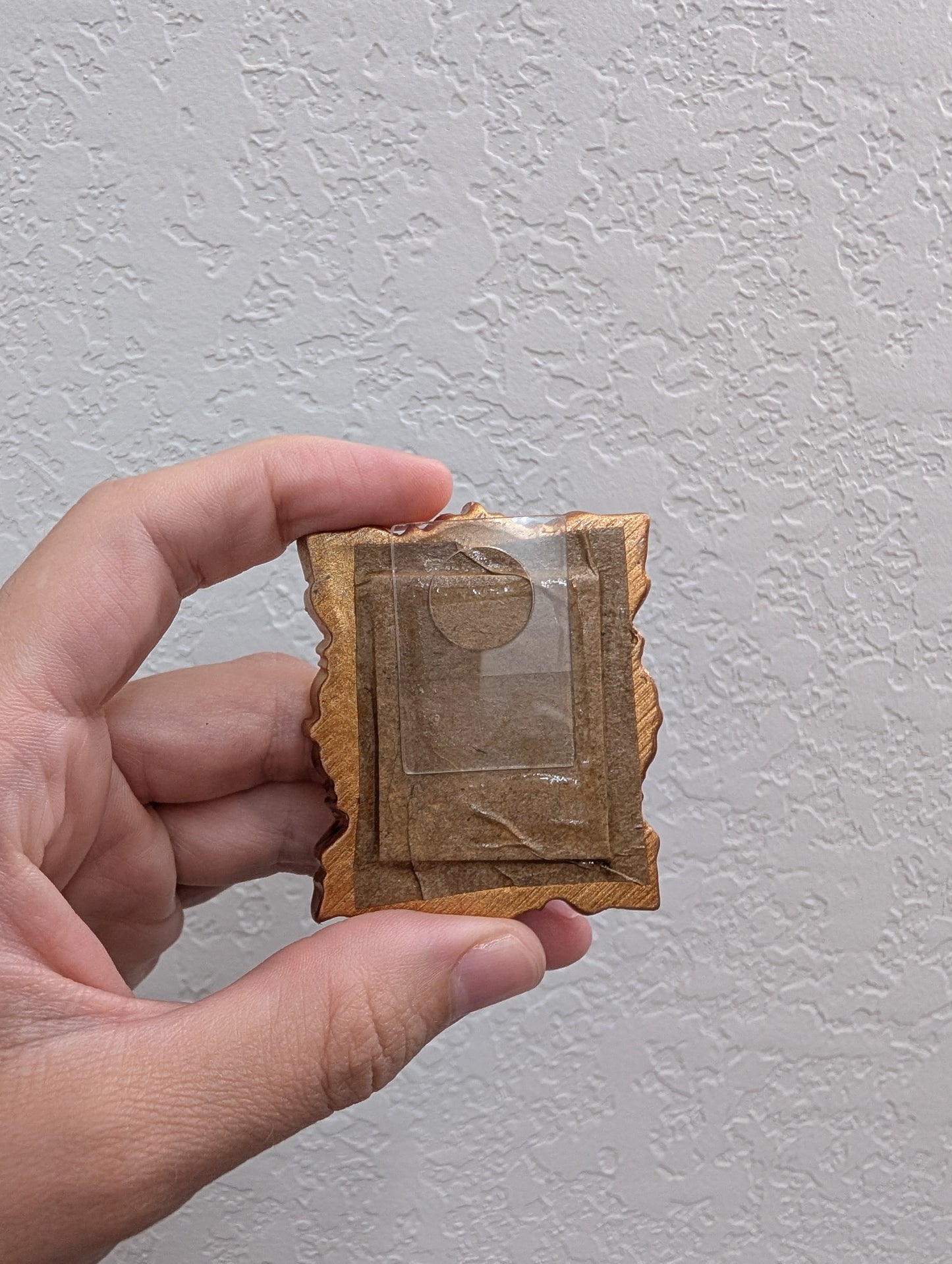 a person holding a piece of paper with a picture on it
