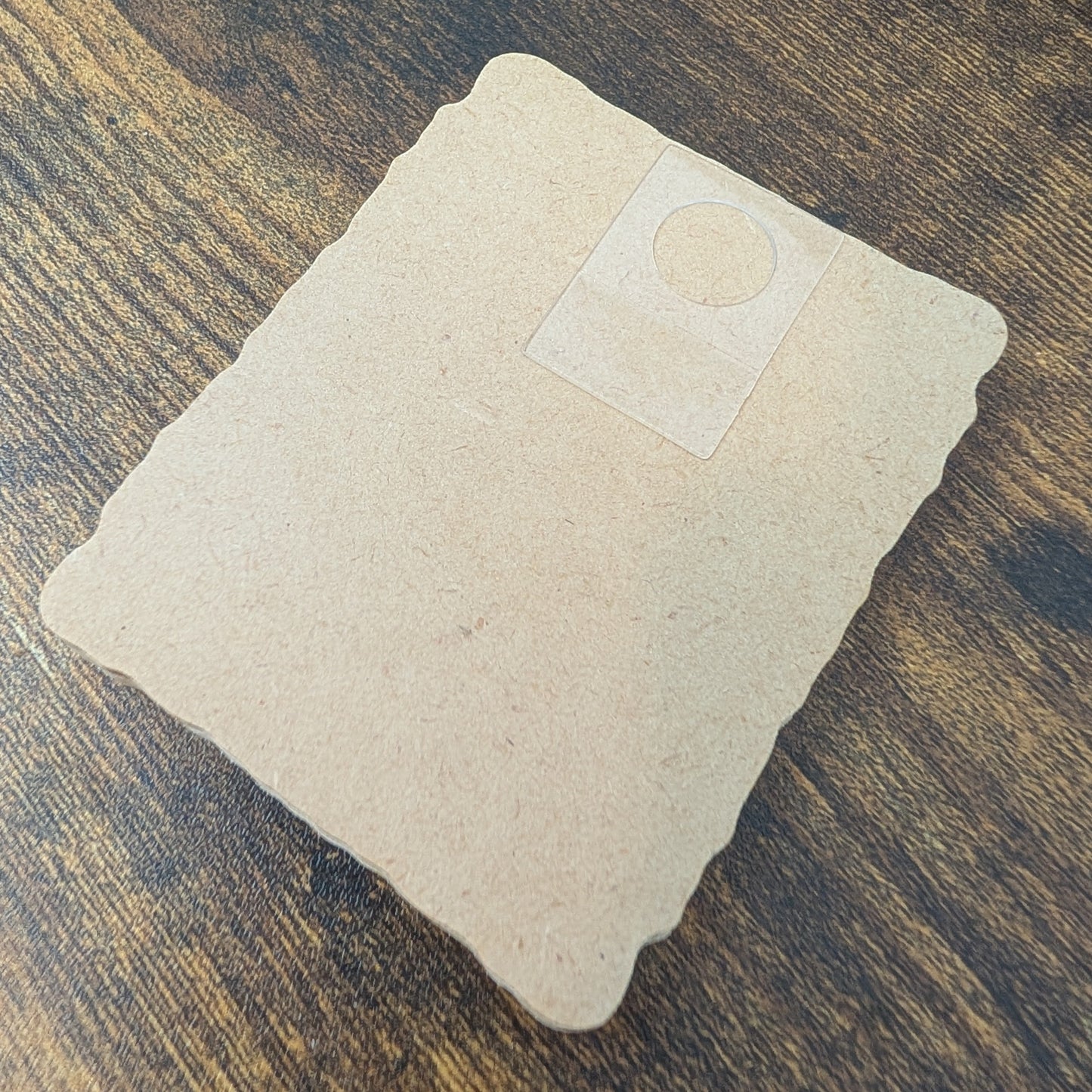 a piece of paper sitting on top of a wooden table