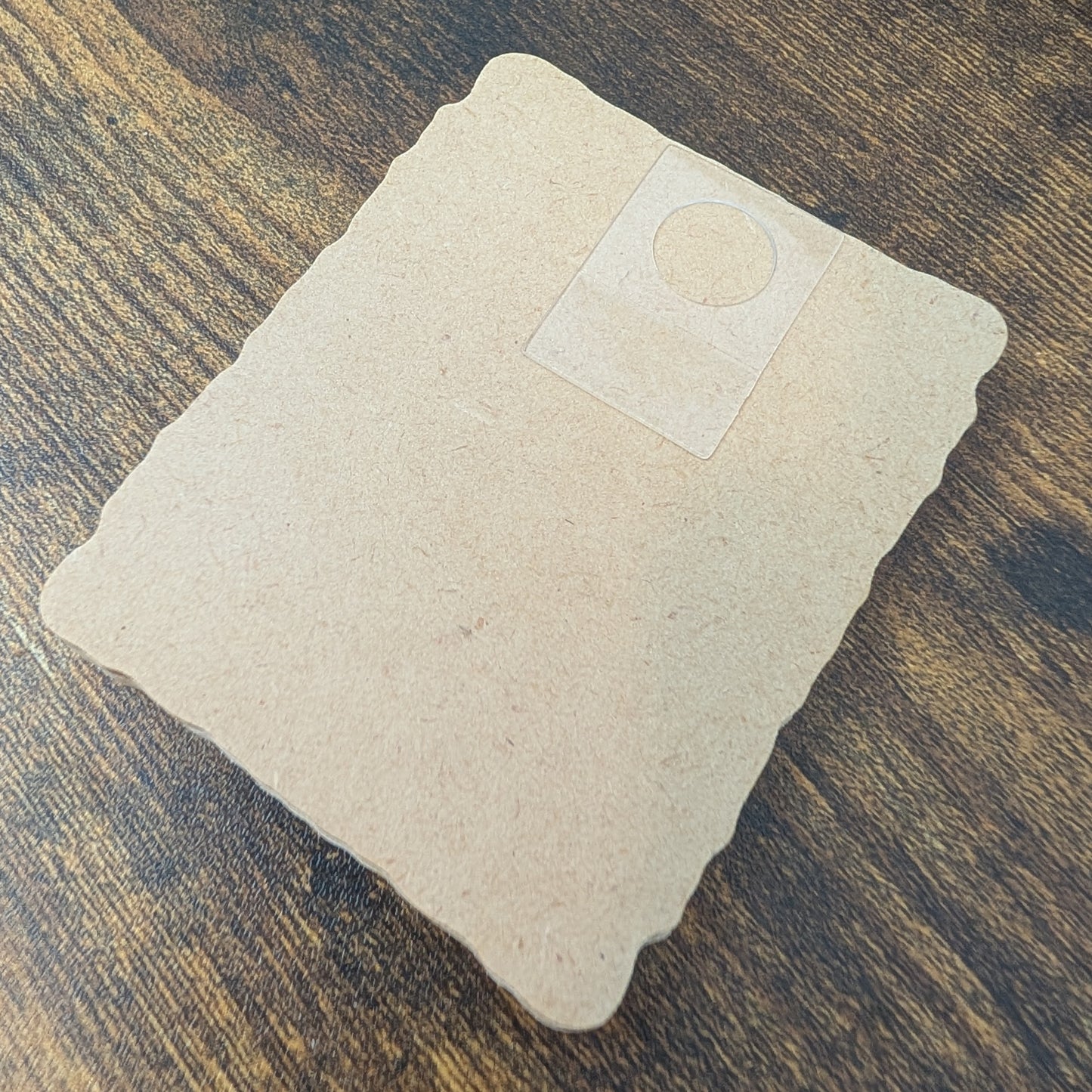 a piece of paper sitting on top of a wooden table
