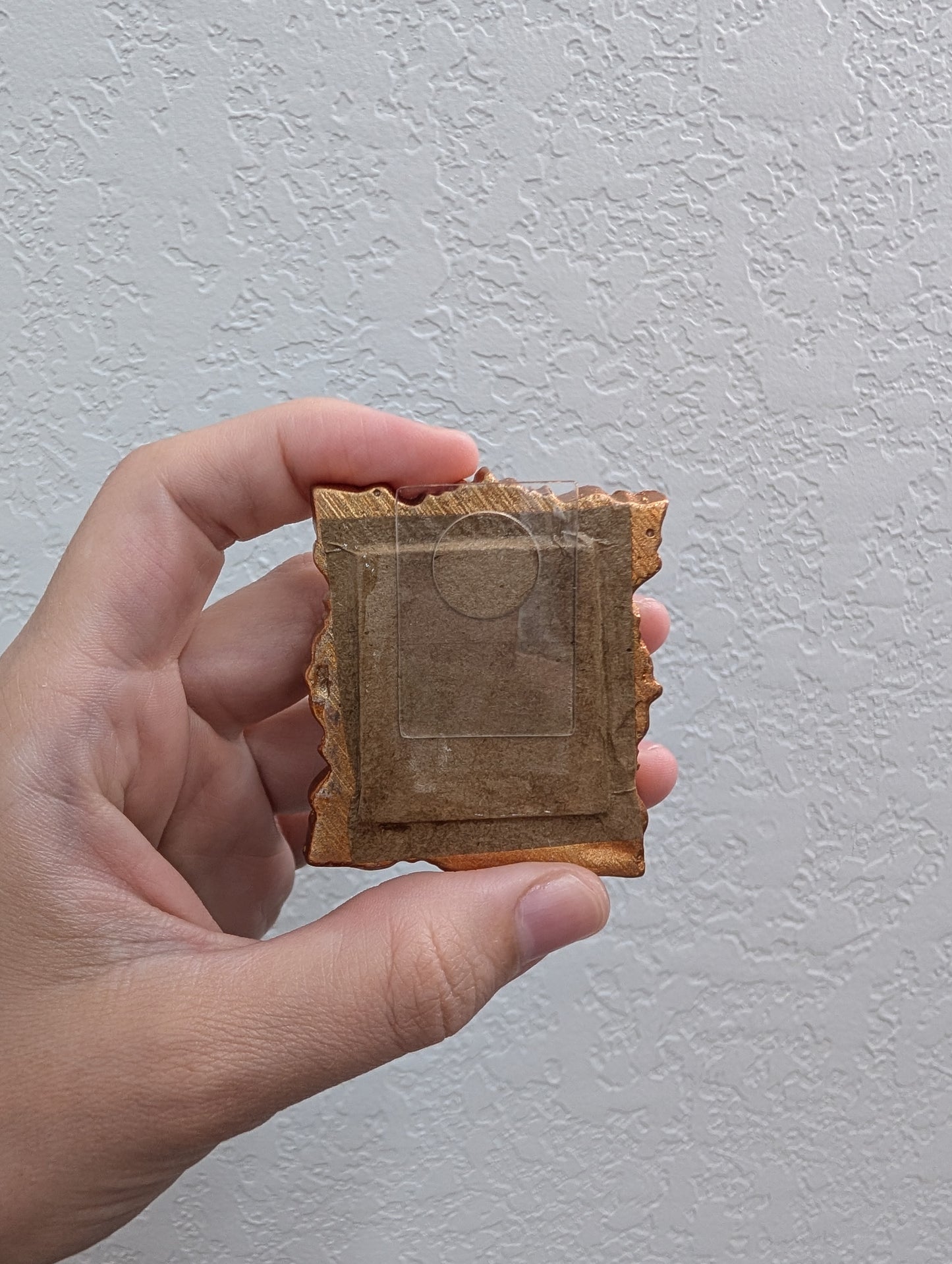 a person holding a piece of bread in their hand