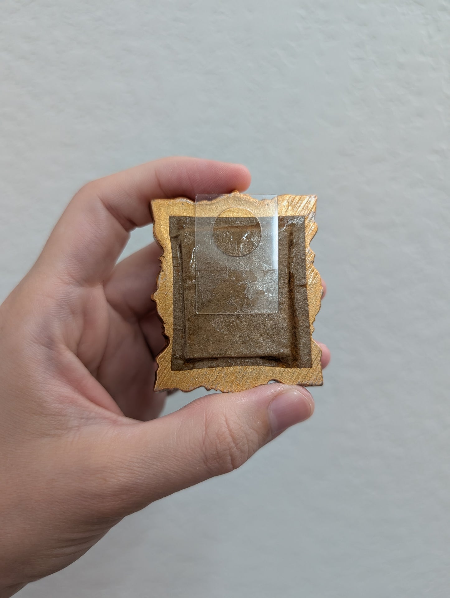 a person holding a piece of paper with a picture in it