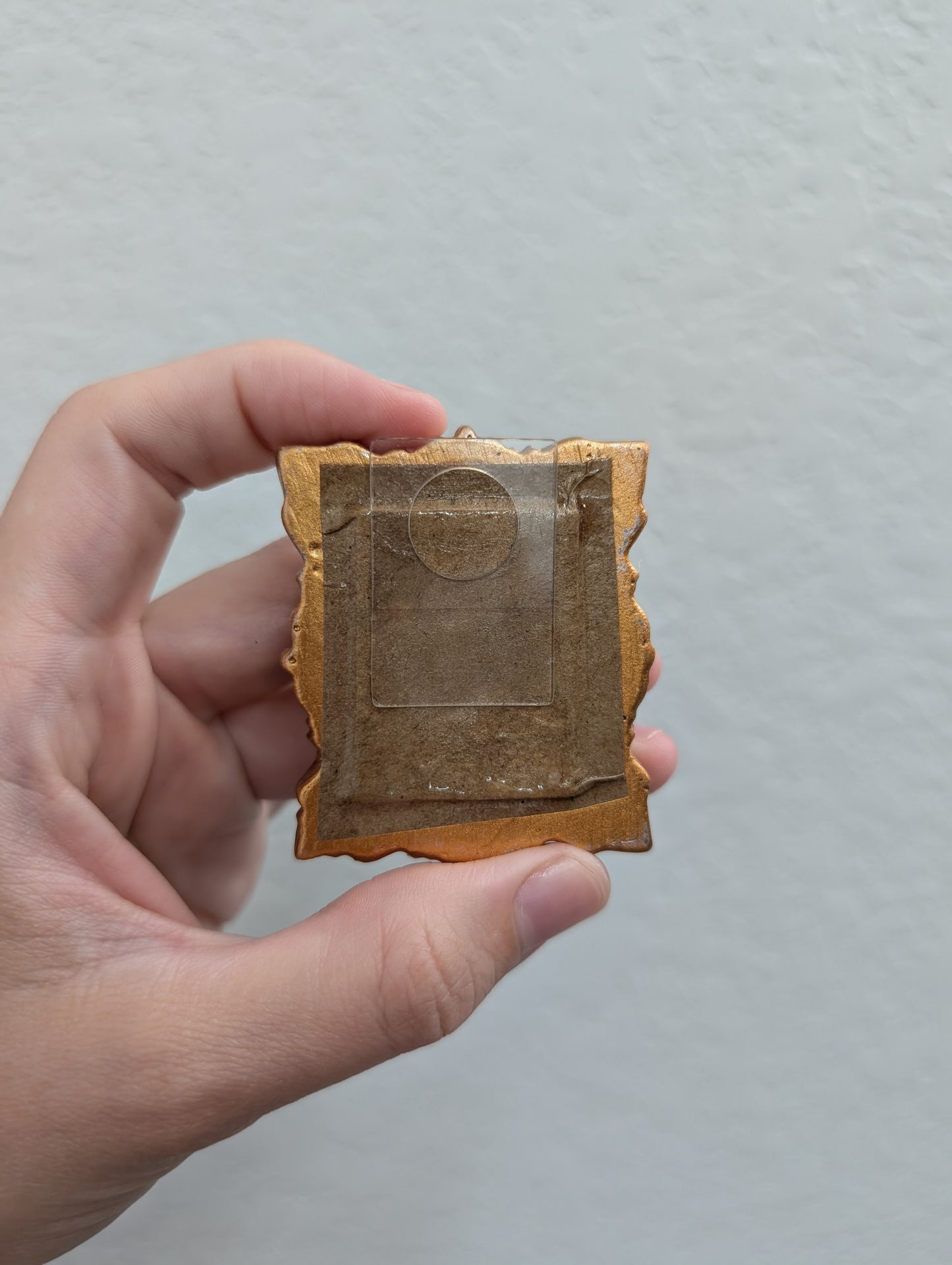 a person holding a piece of paper with a picture on it