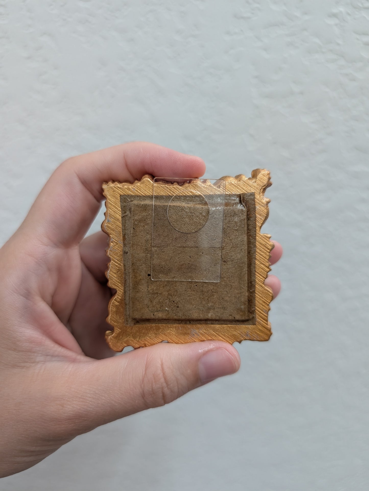 a person holding a piece of cardboard in their hand