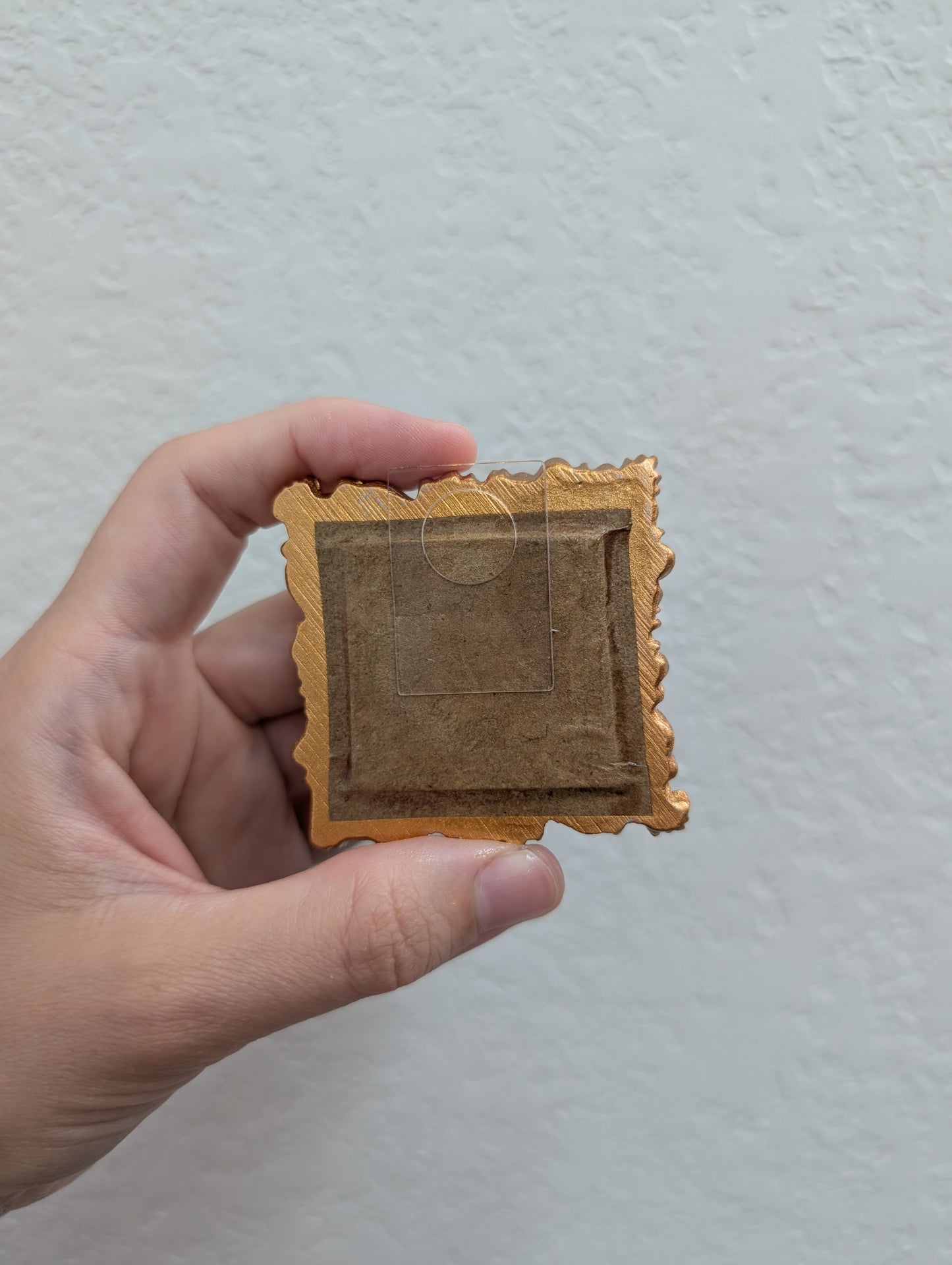 a person holding a piece of paper in their hand