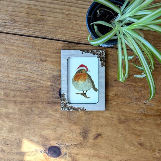 a picture of a bird on a wooden table