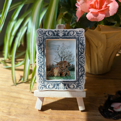 a picture frame with a picture of a man and a dog on it