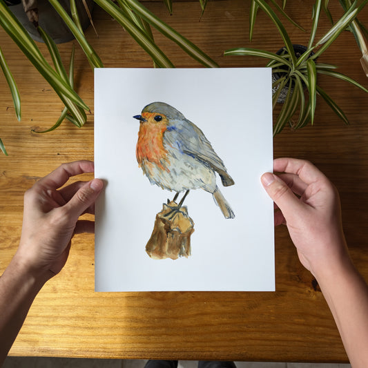 a person holding a card with a bird on it