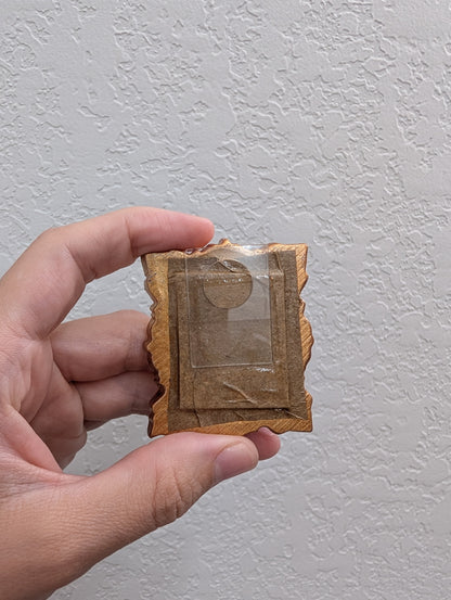 a person holding a piece of paper with a picture on it