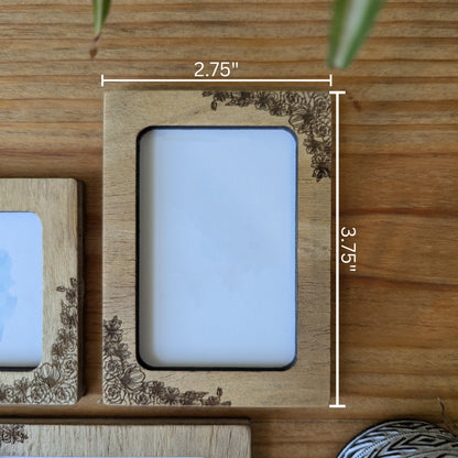 a picture frame sitting on top of a wooden table