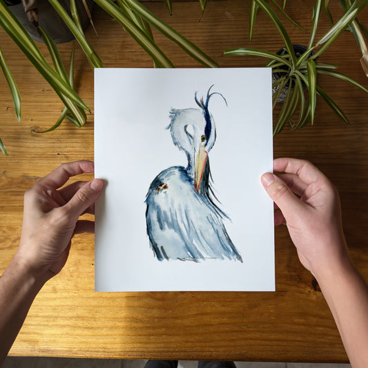 a person holding a card with a picture of a bird on it