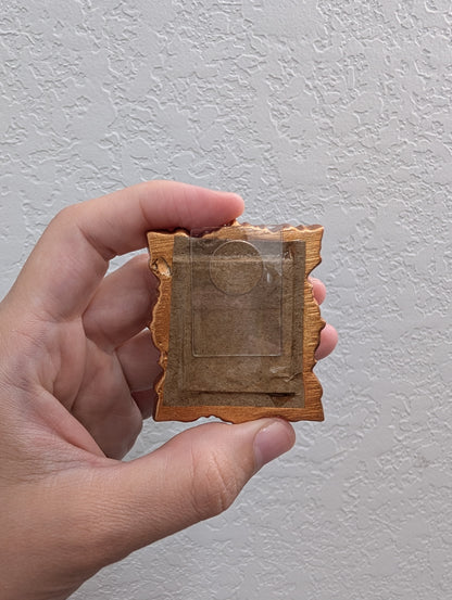 a person holding a piece of paper with a heart on it