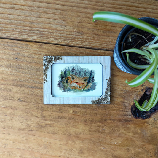 a picture of a deer on a plate on a table