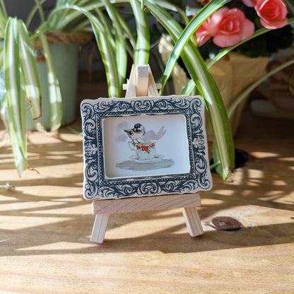 a picture frame with a picture of a bird on it