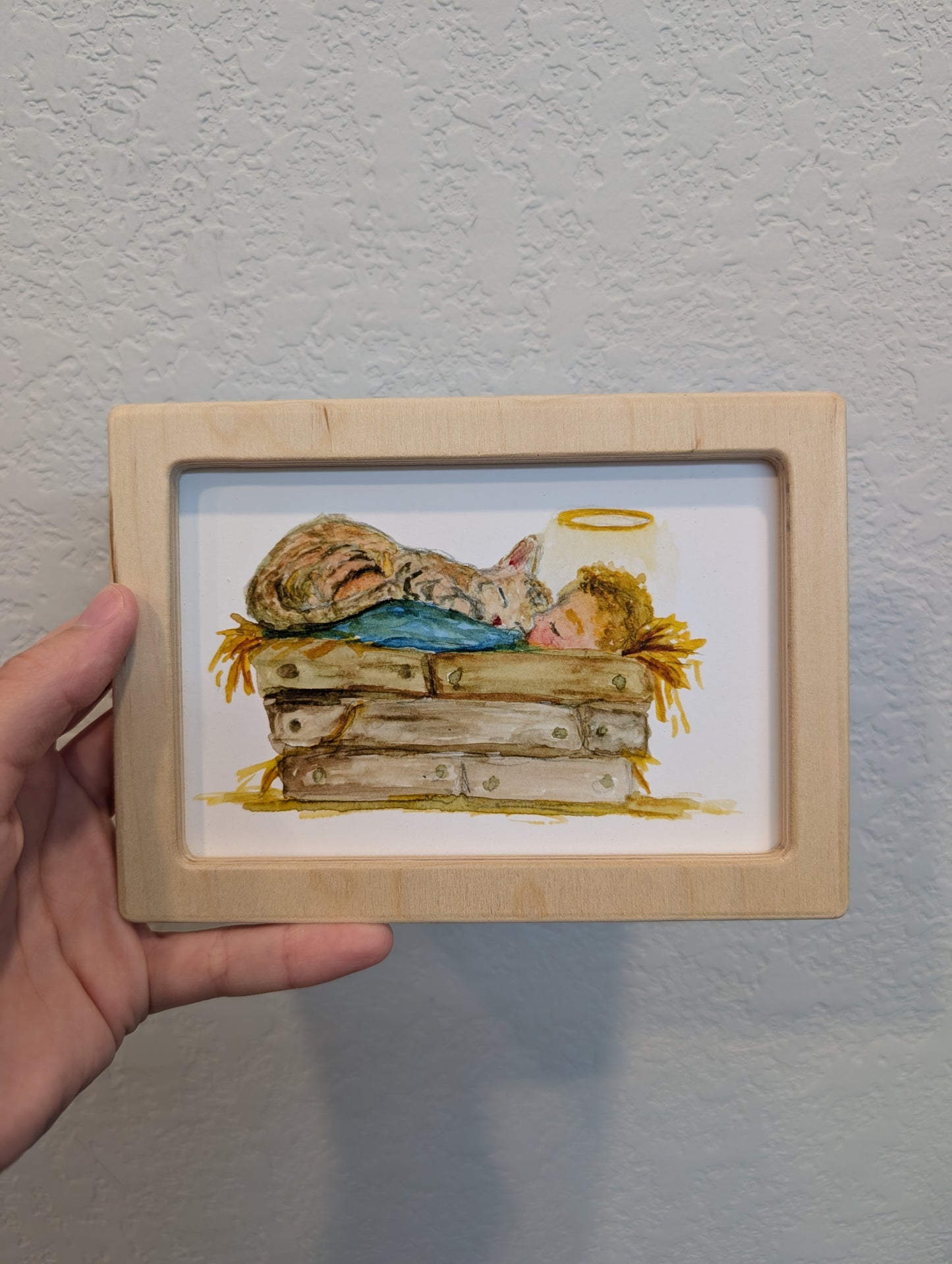 Infant Jesus in Manger with Cat Print - Solidframe Art by Lora Cavallin