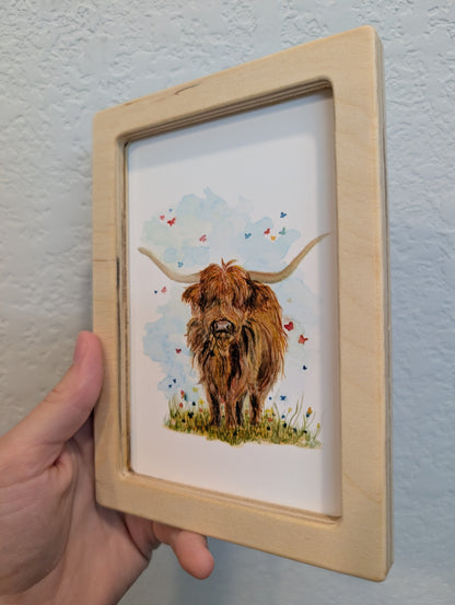 Highland Cow in Field with Butterflies Art Print - Solidframe Art by Lora Cavallin