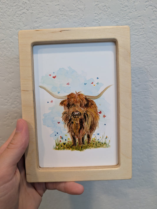 Highland Cow in Field with Butterflies Art Print - Solidframe Art by Lora Cavallin